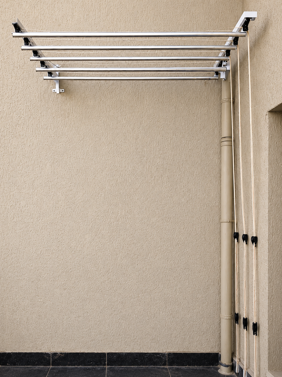 Messy balcony space before cloth drying system